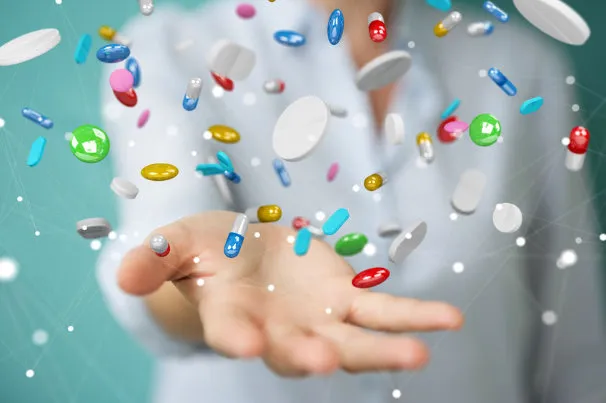 bipolar disorder medication management picture of pills falling into a hand